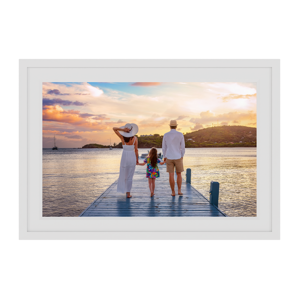 Framed photograph of a family on a dock at sunset.