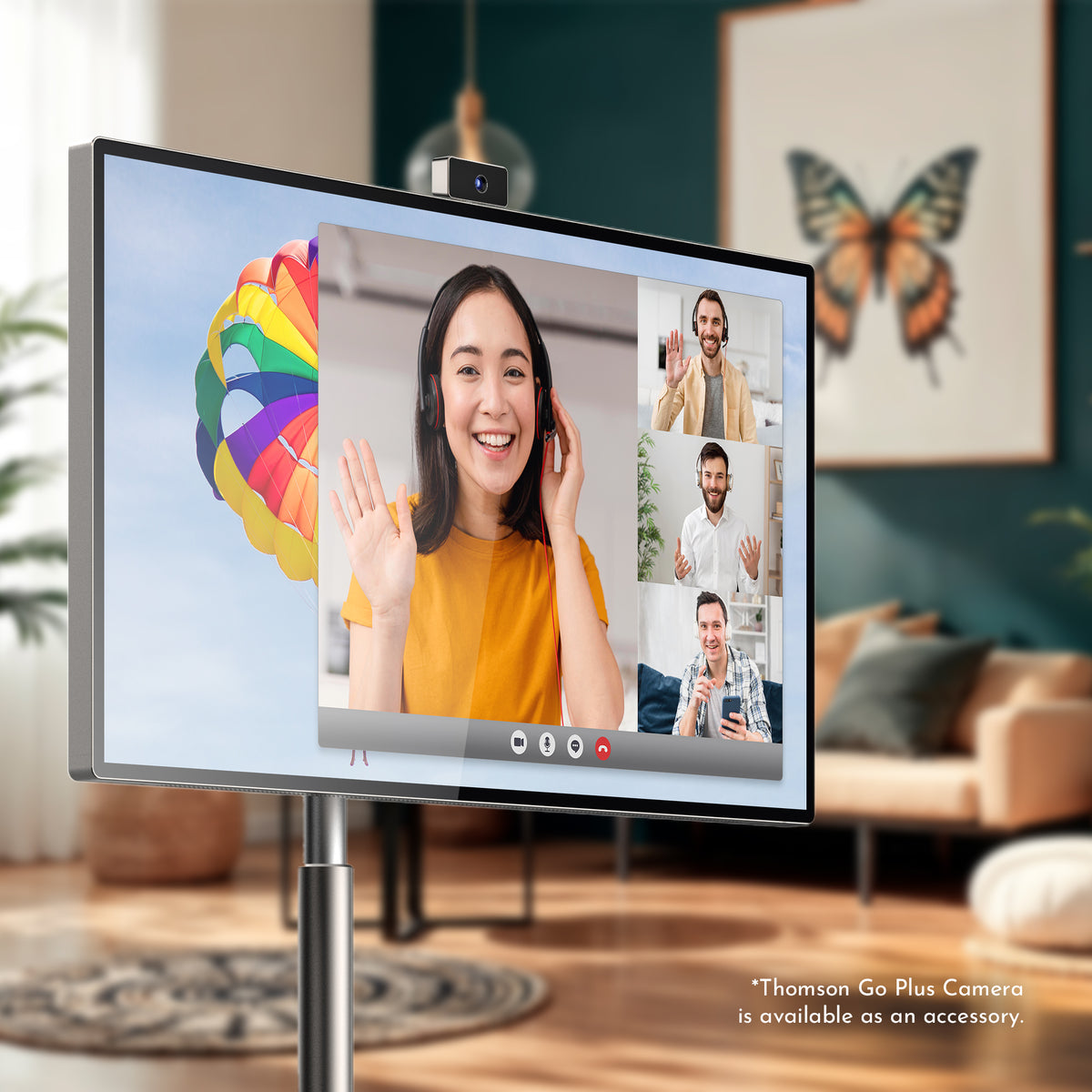 Monitor displaying a video call with a colorful brain illustration on a stand in a living room.